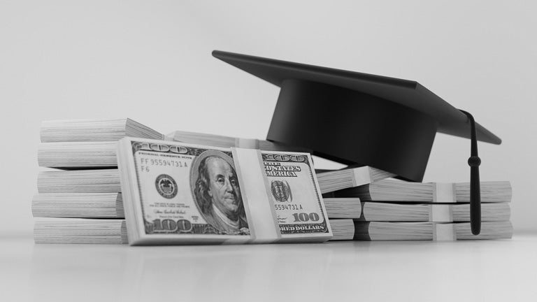 photo of cash with graduation cap