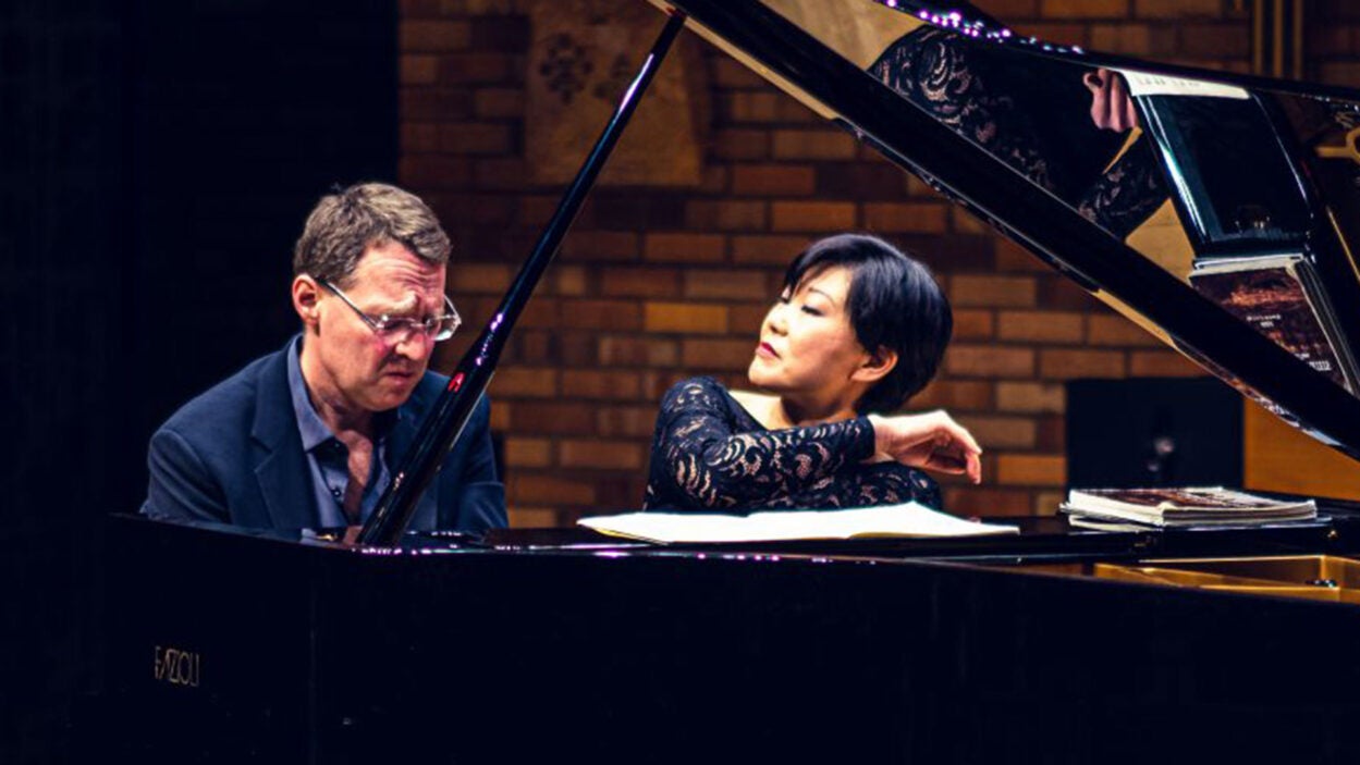 photo of pianists Stephanie Ho and Saar Ahuvia